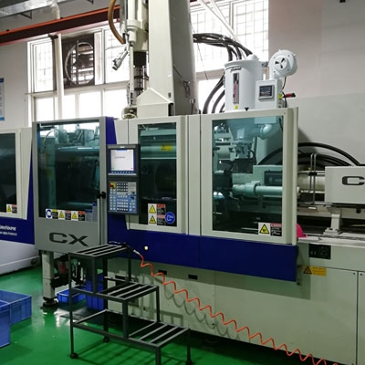 Rotary paddle level switch for plastic processing